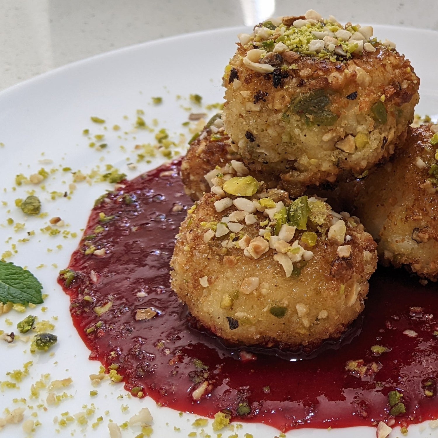 ELDERFLOWER, PISTACHIO & HAZLENUT ARANCINI WITH STRAWBERRY & PROSECCO COULI 