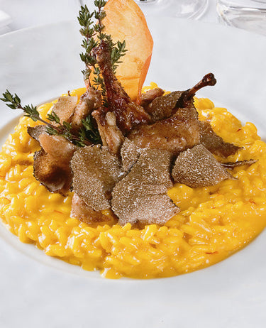 foto ricetta Riso con zafferano, petti di quaglia e tartufo bianco 
